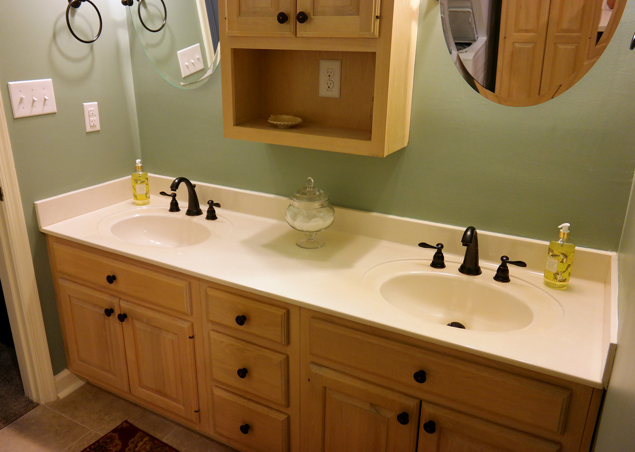Bathroom refurbish of the sink area, cabinets and mirror