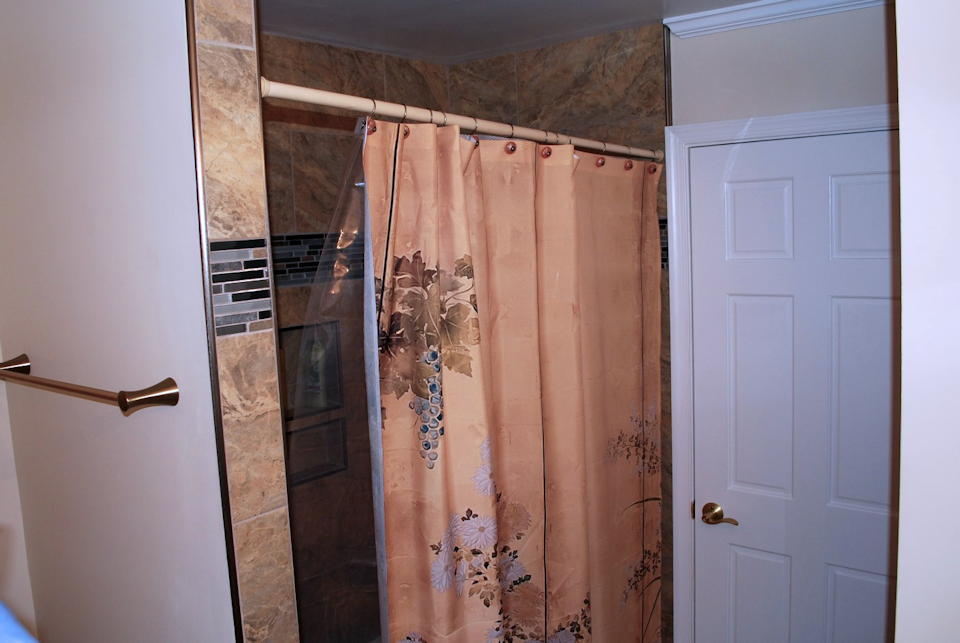 Kirkman after shot of shower curtain and towel rack