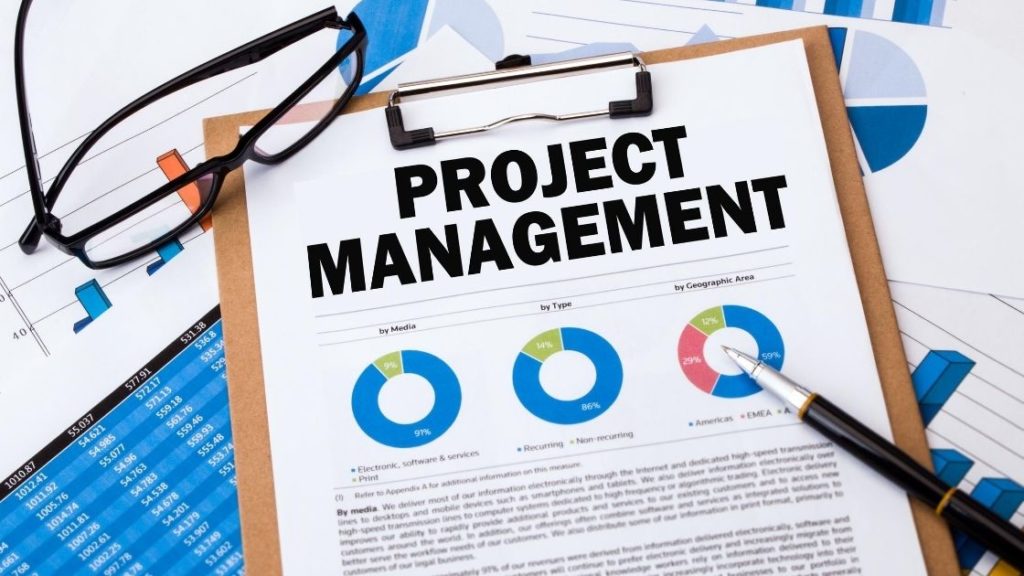 project management clipboard with glasses and pen
