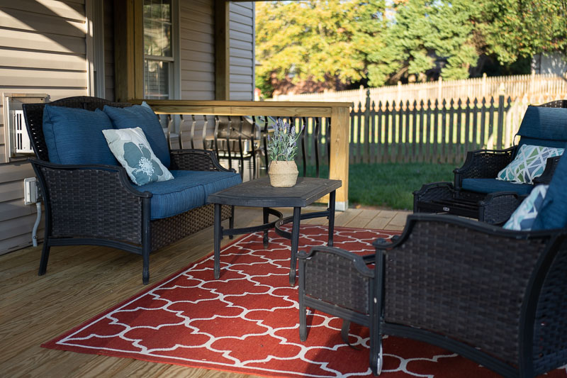 New finished deck in Kernersville with rugs and outdoor furniture
