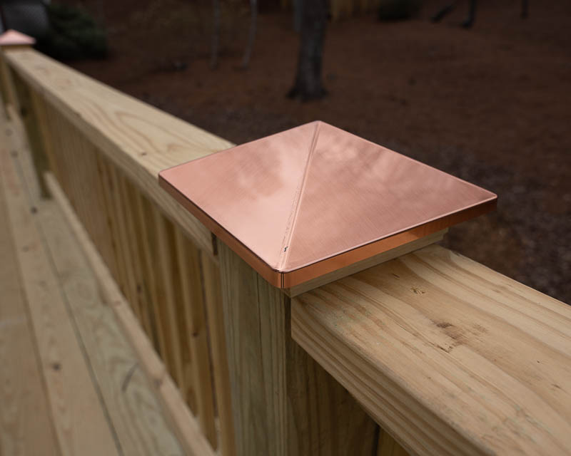 Copper finished caps on a newly built deck