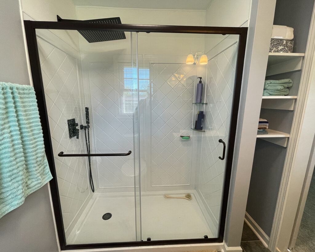 New sliding door shower as part of a finished bathroom remodel