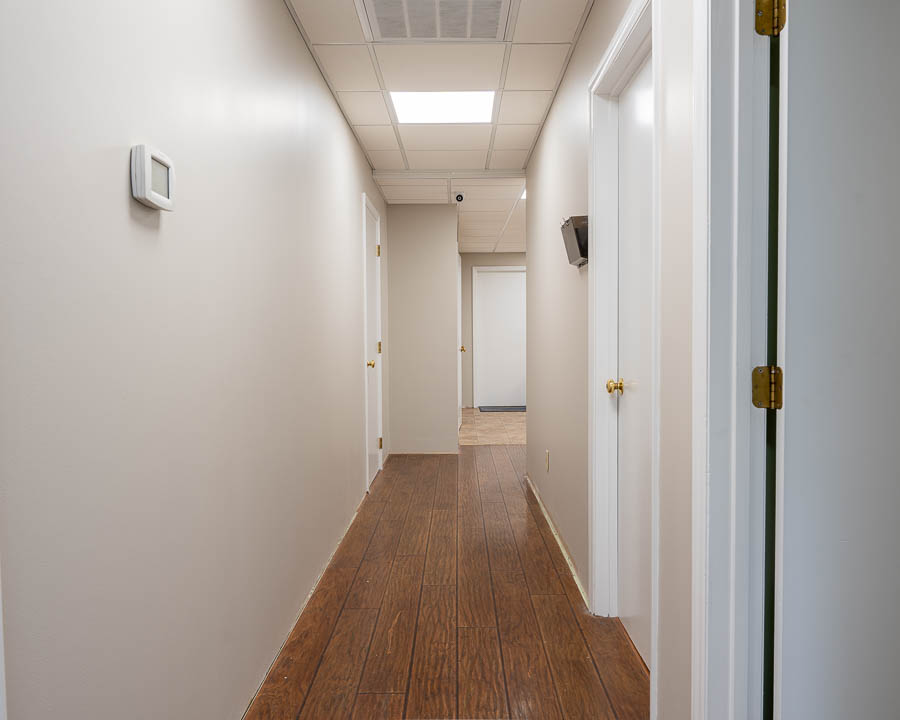 New hardwood flooring in a hallway remodel