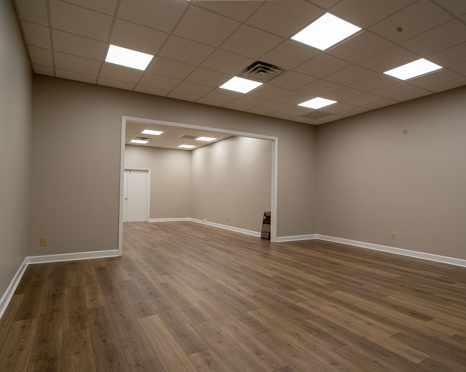 Commercial showroom remodeled flooring and lights