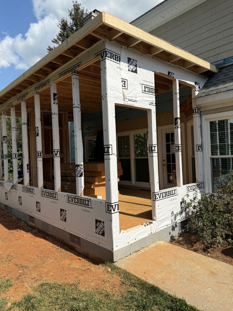 Tyvek sheets in place on the outer walls of the screened in porch